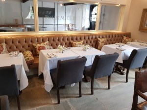 Deep buttoned leather banquette